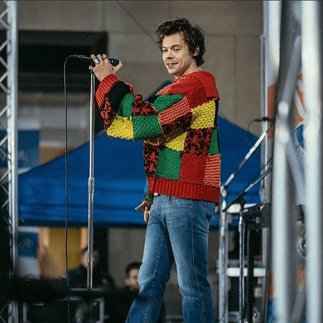 Harry Styles wearing a colorful JW Anderson cardigan