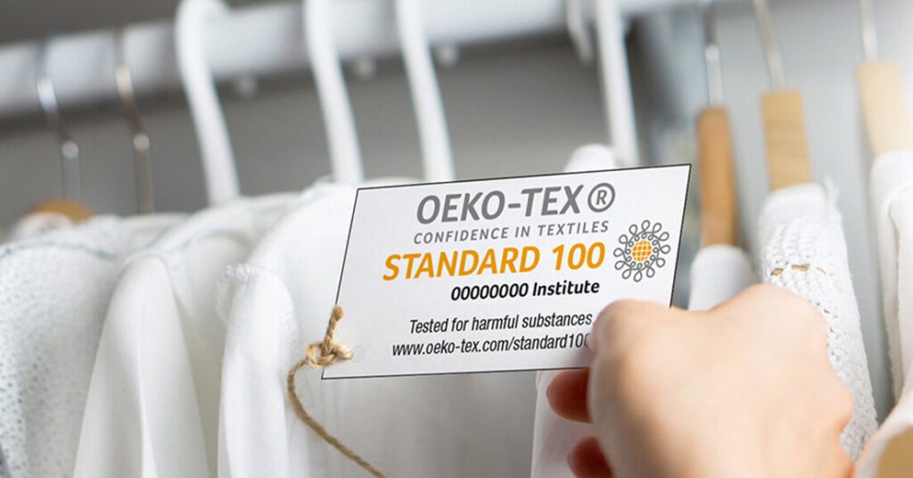 An OEKO-TEX Standard 100 label on a top