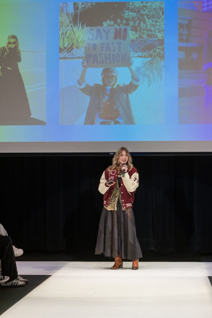 Lexy Silverstein speaks at the Deja Vu Through the Decades fashion show