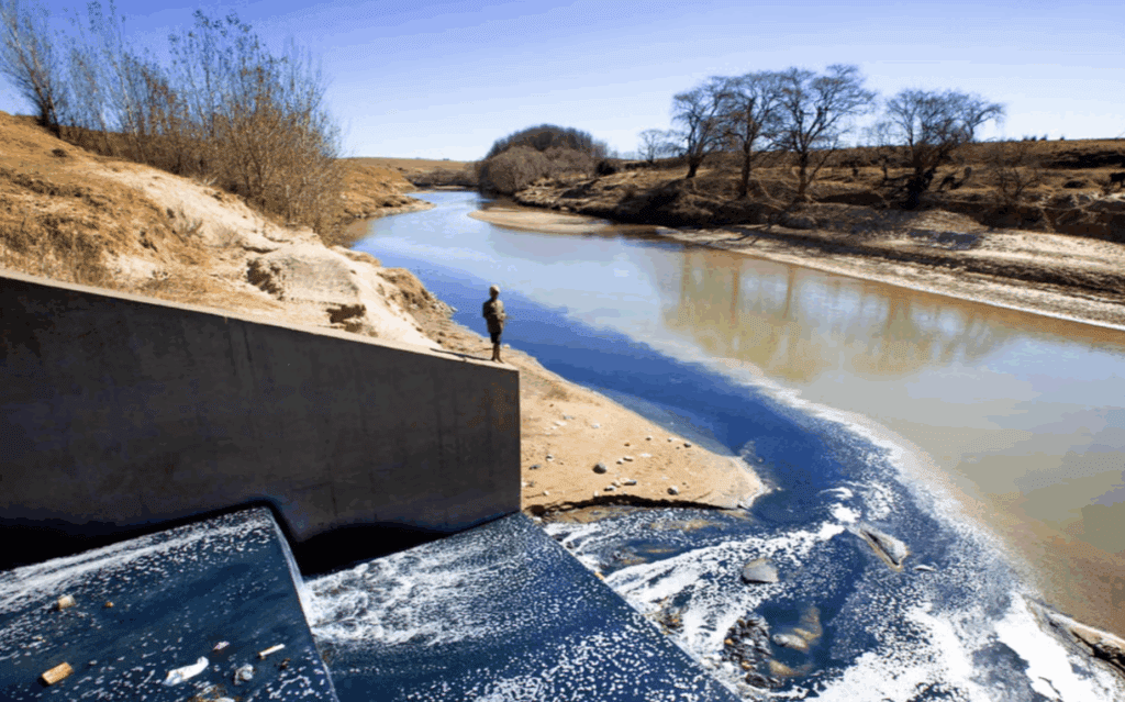 Effluent from Maseru's garment factories - in particular dyes for jeans - flow into the Caledon (Mahokare) River in Lesotho, South Africa (Robin Hammond/Panos) Independent 